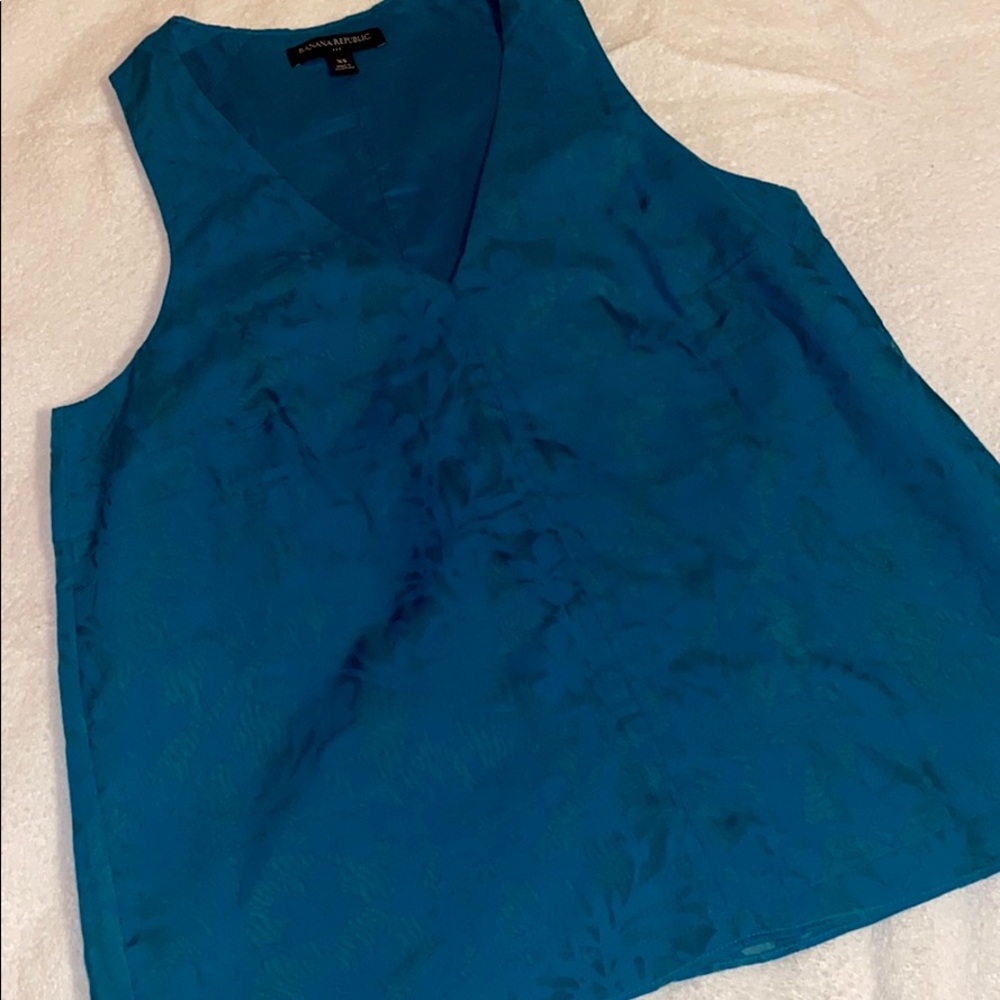 Teal sleeveless blouse